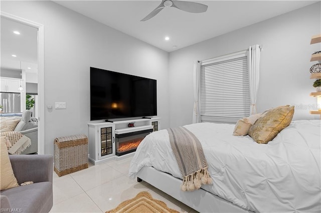 bedroom featuring stainless steel fridge and ceiling fan