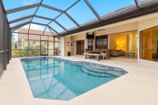 view of swimming pool with a lanai, a patio area, ceiling fan, and an outdoor hangout area