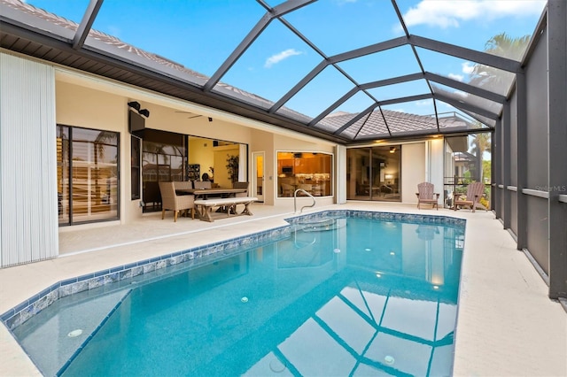 view of swimming pool featuring an outdoor hangout area, a patio, and a lanai