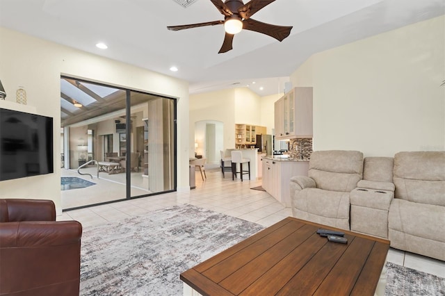 tiled living room with ceiling fan