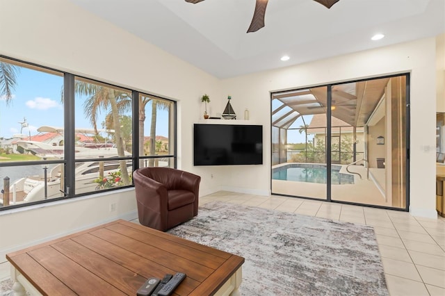 tiled living room with ceiling fan