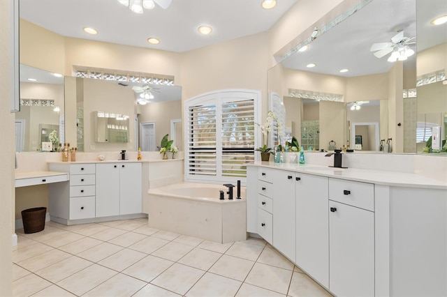 bathroom featuring tile patterned flooring, a bath, vanity, and ceiling fan