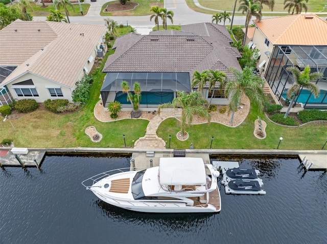 birds eye view of property with a water view