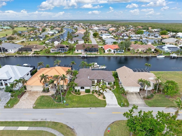 aerial view with a water view and a residential view