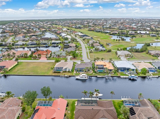 aerial view with a residential view and a water view