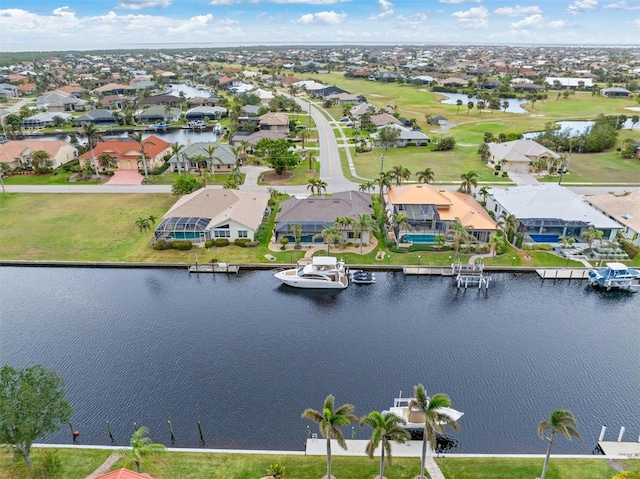 bird's eye view with a water view and a residential view