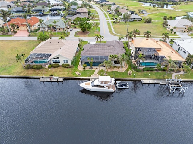 bird's eye view with a water view and a residential view