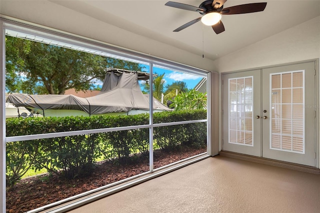 unfurnished sunroom with french doors, vaulted ceiling, a wealth of natural light, and ceiling fan