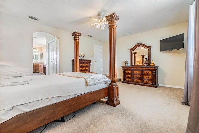 carpeted bedroom featuring ensuite bathroom and ceiling fan