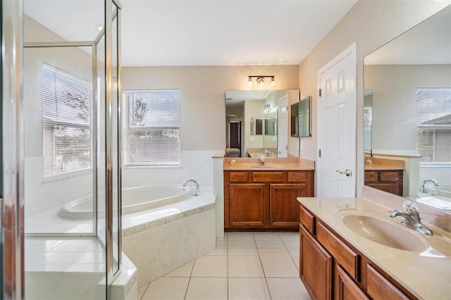 bathroom with tile patterned flooring, vanity, and plus walk in shower