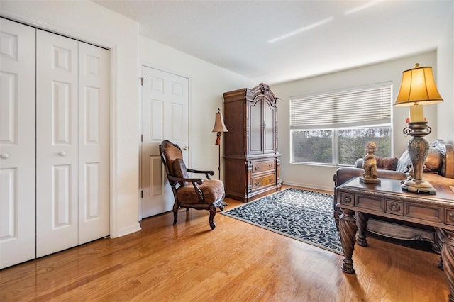 sitting room with light hardwood / wood-style flooring