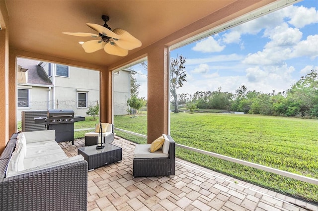 view of patio with outdoor lounge area, ceiling fan, and a grill