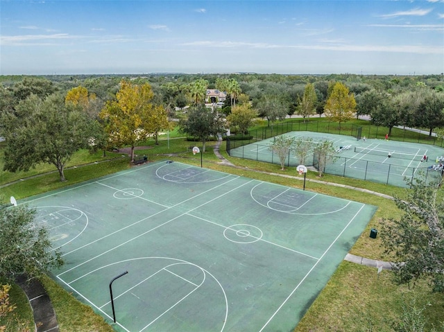 view of basketball court featuring a yard