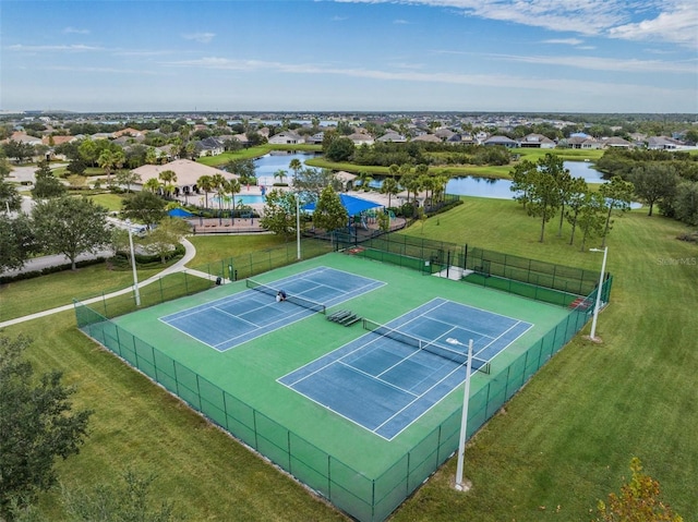 view of sport court featuring a water view