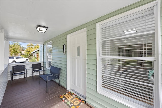 wooden terrace featuring a porch