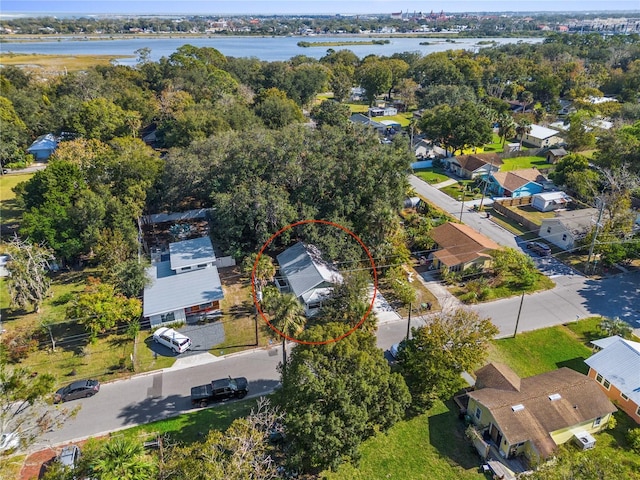 birds eye view of property featuring a residential view and a water view