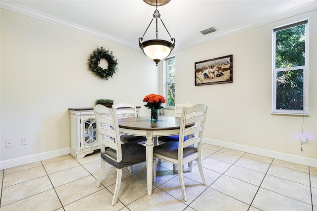 tiled dining area with crown molding