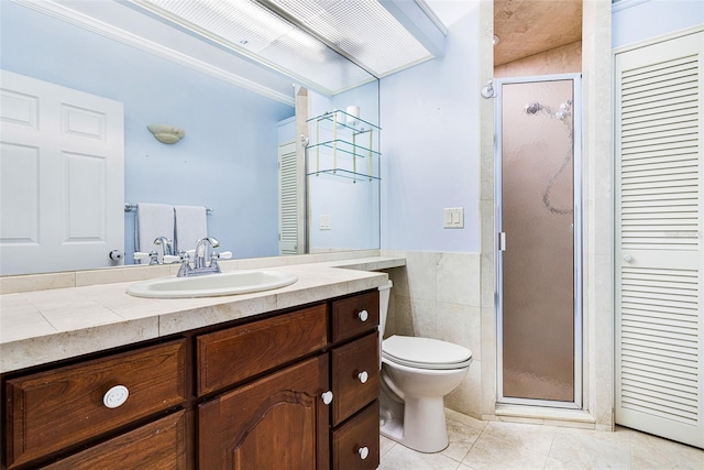 bathroom featuring tile patterned floors, an enclosed shower, toilet, vanity, and ornamental molding