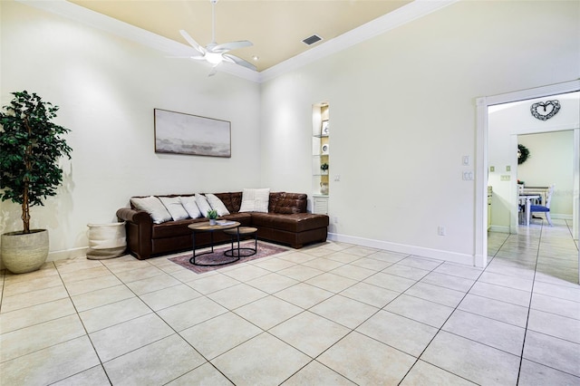 tiled living room with high vaulted ceiling, ceiling fan, and crown molding