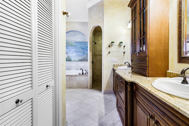 bathroom with vanity, tile patterned floors, crown molding, and separate shower and tub