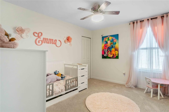 bedroom featuring carpet flooring, a ceiling fan, and baseboards