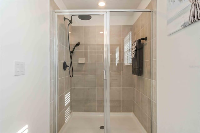 bathroom with a shower stall