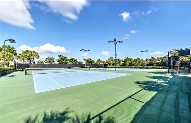 view of sport court featuring community basketball court and fence