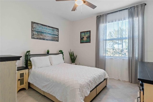 bedroom featuring light tile patterned floors and ceiling fan