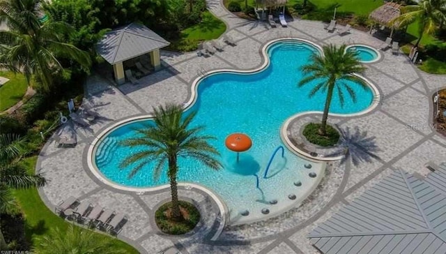 community pool featuring a patio area