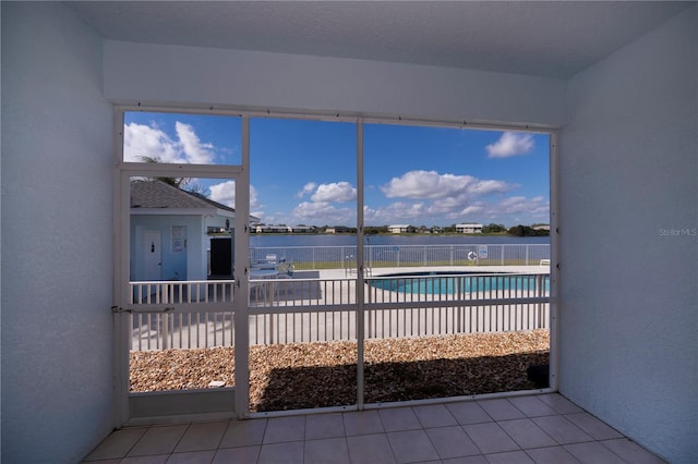 view of swimming pool with a water view