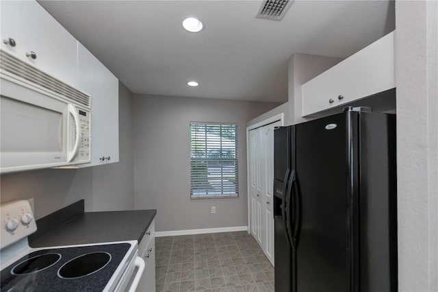 kitchen with white cabinets and white appliances