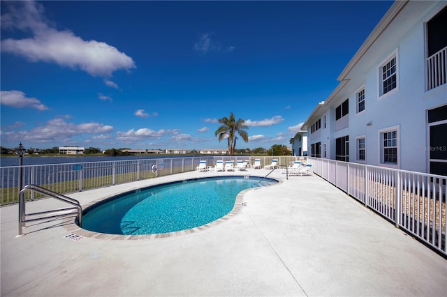 view of swimming pool with a patio