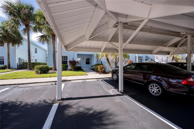 view of parking / parking lot with a carport