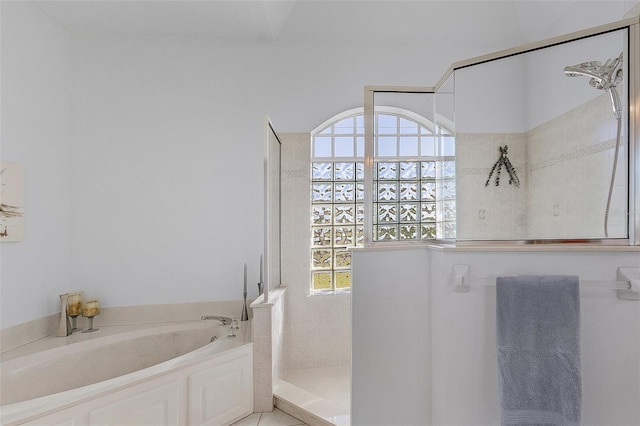 full bath featuring a garden tub and walk in shower