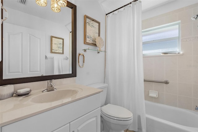 full bathroom with toilet, vanity, vaulted ceiling, and shower / bath combo with shower curtain