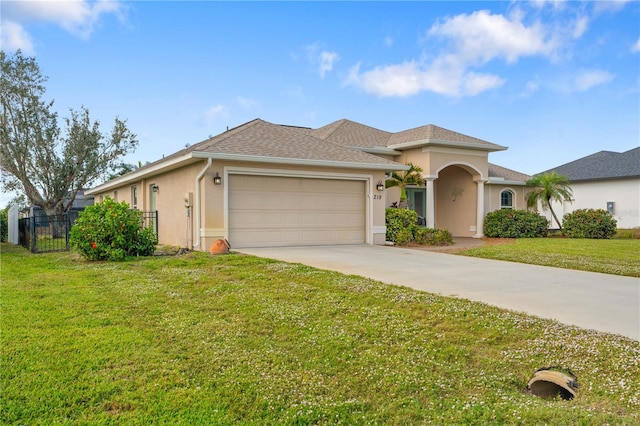 view of front facade featuring a garage and a front lawn