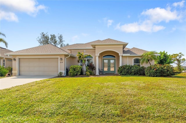 mediterranean / spanish house featuring french doors, a front lawn, and a garage