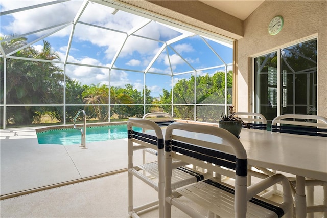 outdoor pool with a patio area and a lanai