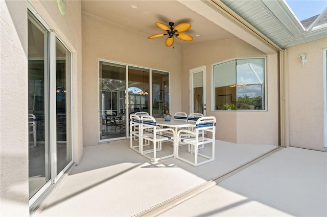 view of patio / terrace featuring outdoor dining area and a ceiling fan