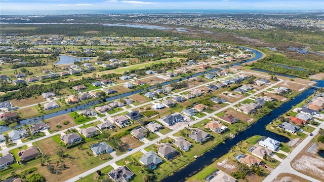 aerial view featuring a residential view and a water view