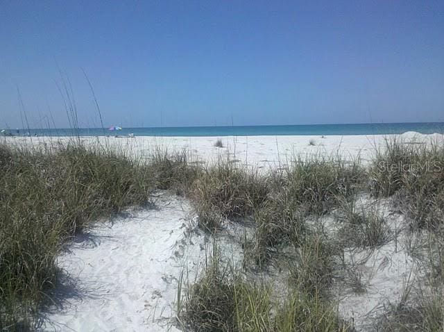 property view of water featuring a beach view