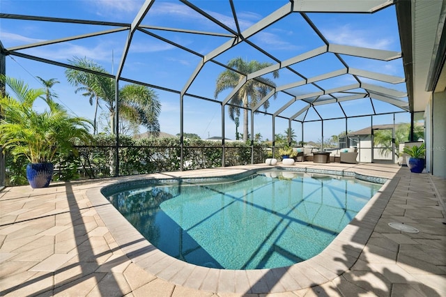 view of pool featuring a patio area and a lanai