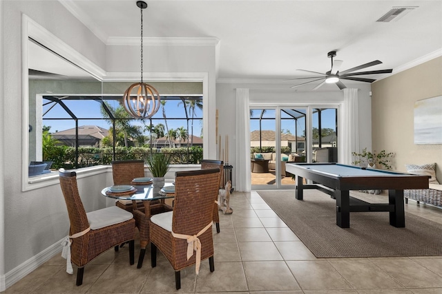 tiled dining area with crown molding, a healthy amount of sunlight, and pool table