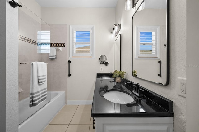 bathroom featuring tile patterned floors, vanity, and tiled shower / bath