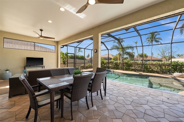 exterior space featuring a fenced in pool, ceiling fan, and a lanai