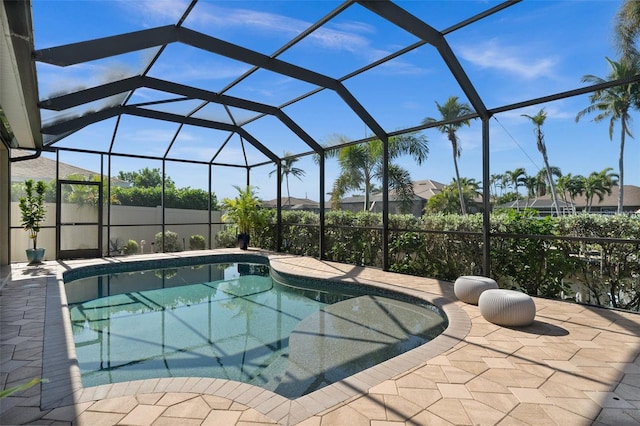 view of pool featuring a lanai and a patio area