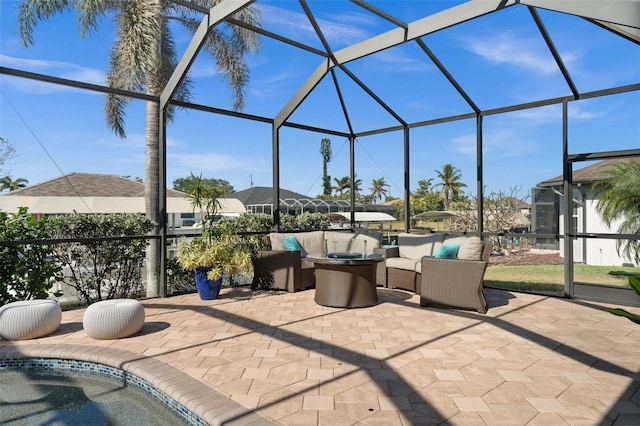 view of patio with outdoor lounge area and a lanai