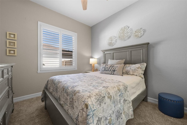 carpeted bedroom with ceiling fan and lofted ceiling