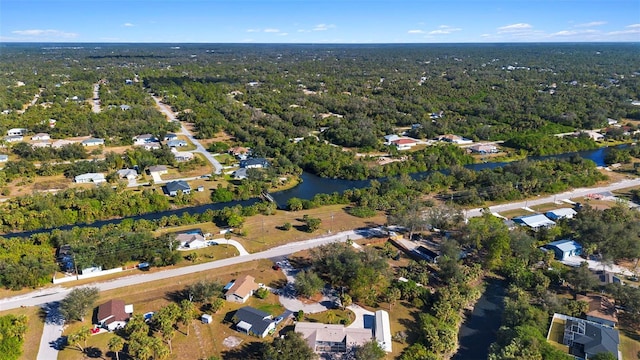 drone / aerial view featuring a water view and a residential view