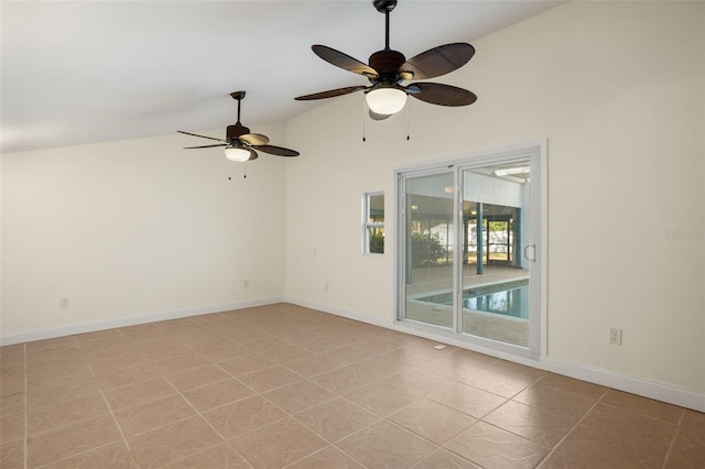 spare room featuring ceiling fan, high vaulted ceiling, light tile patterned flooring, and baseboards